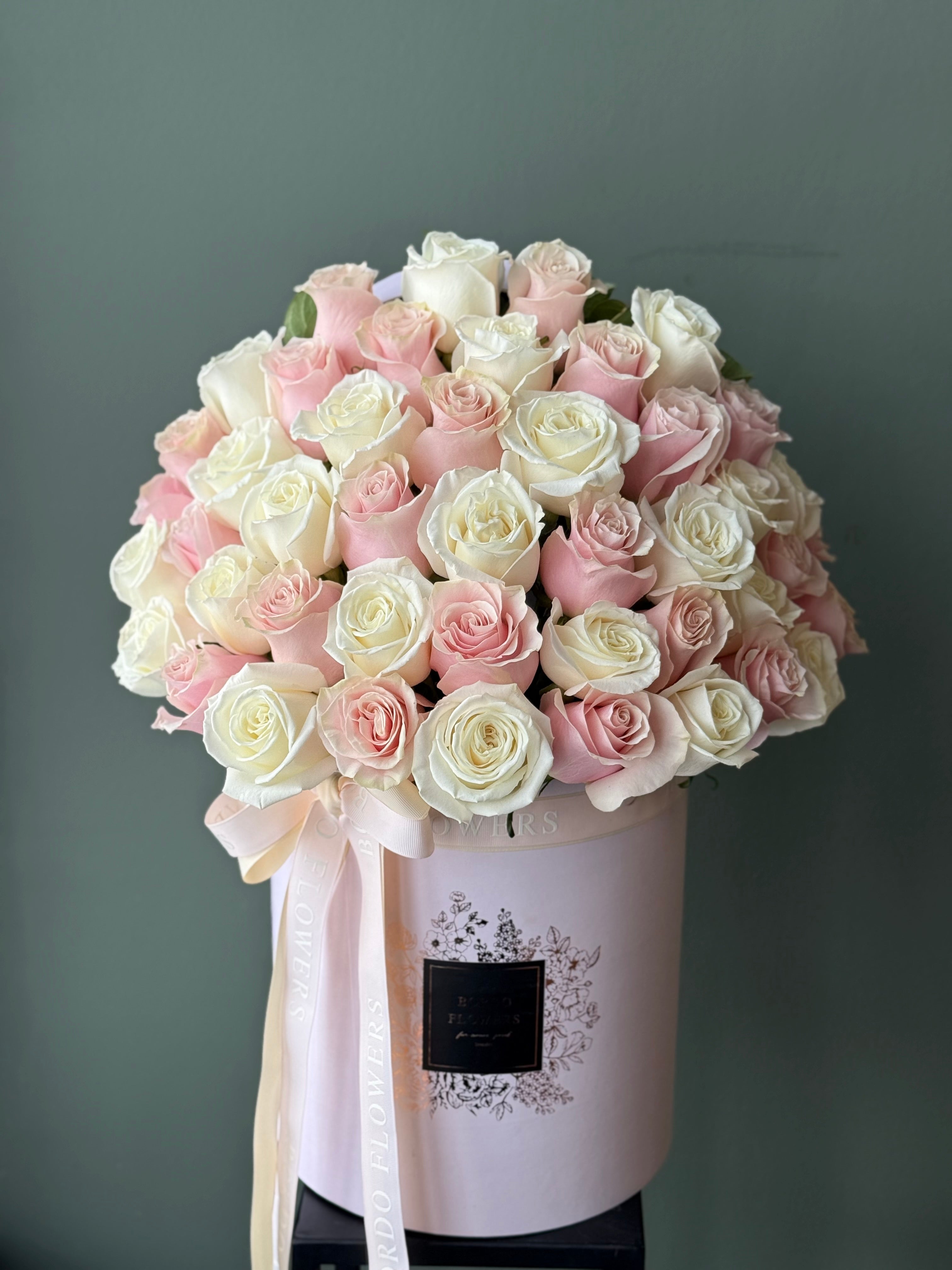 "50 Reasons Why" arrangement: 50 premium roses in a refined box design with a front-facing display. Includes wet floral sponge. Design confirmed in Chicago.