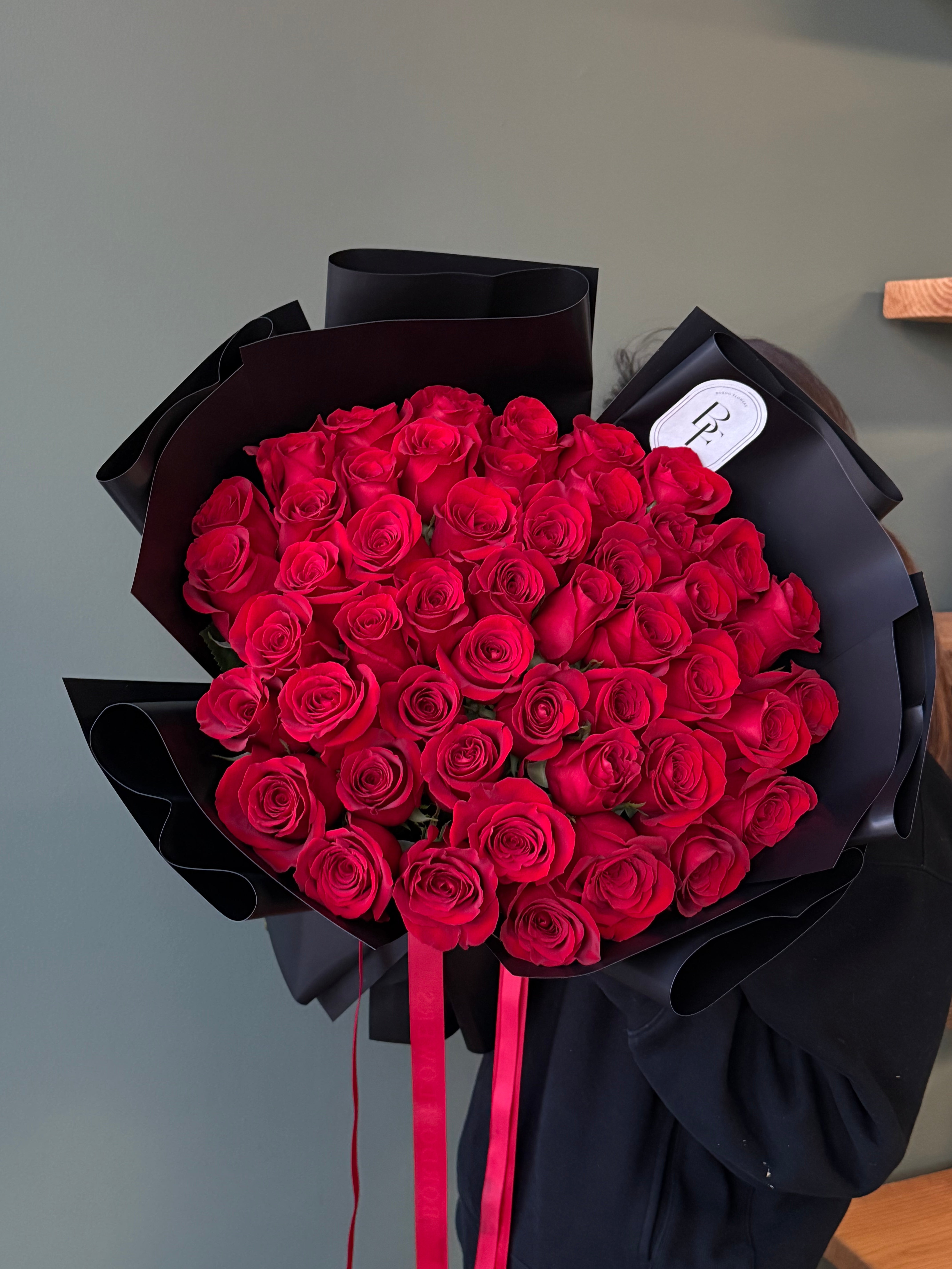 “50 red roses in a bouquet”