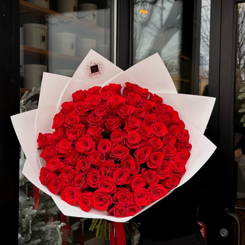 Introducing our stunning bouquet of 75 Red Roses, aptly named "Freedom." This exquisite arrangement features long-stemmed roses, each representing love, passion, and admiration. The vibrant red blooms are carefully selected for their exceptional quality, ensuring a breathtaking display that captivates the heart. Perfect for expressing deep emotions on special occasions such as anniversaries, birthdays, or romantic gestures, this luxurious bouquet creates a dramatic impact. Wrapped elegantly with lush greenery, the "Freedom" bouquet is not just a gift but a powerful statement of affection. Whether for a loved one or a grand celebration, this arrangement is sure to leave a lasting impression. Celebrate love and passion with the timeless beauty of our 75 Red Roses bouquet.