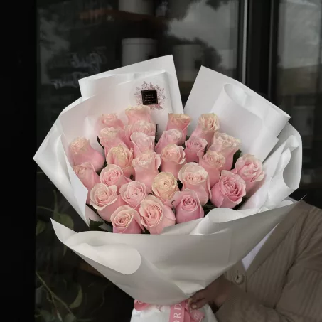 This stunning bouquet features two dozen exquisite roses in your choice of colors, including elegant whites, soft pinks, warm peaches, and subtle beiges. You can also opt for a delightful mix of these beautiful hues to create a personalized arrangement that perfectly suits your taste. Each rose is hand-selected for its exceptional quality, ensuring a breathtaking display that radiates beauty and sophistication. Ideal for any occasion—be it a birthday, anniversary, or simply to express love and appreciation—this elegant gift is sure to leave a lasting impression. Wrapped in delicate, complementary paper, this bouquet not only showcases the natural charm of the roses but also adds a touch of class to any setting.